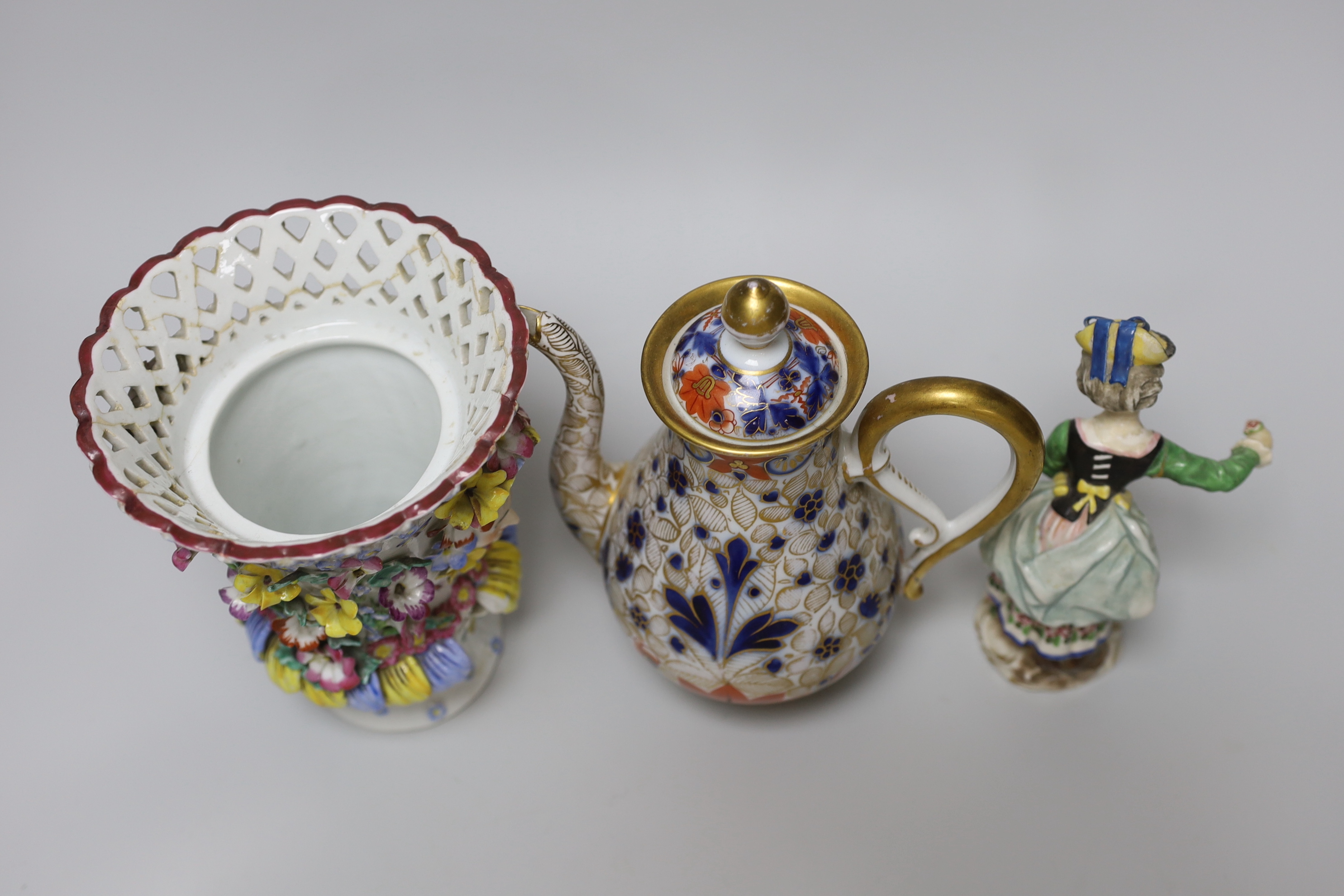 A 19th century German figure of a girl, 19cm, Vienna-type female figure, German figure of a boy and similar figure group, a continental coffee pot and an encrusted vase, the largest 18cm high
